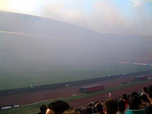 Smoke covering the pitch. It stayed this way for a few minutes - we were surprised they played through it and didn't stop play. We couldn't see the action for a couple minutes.